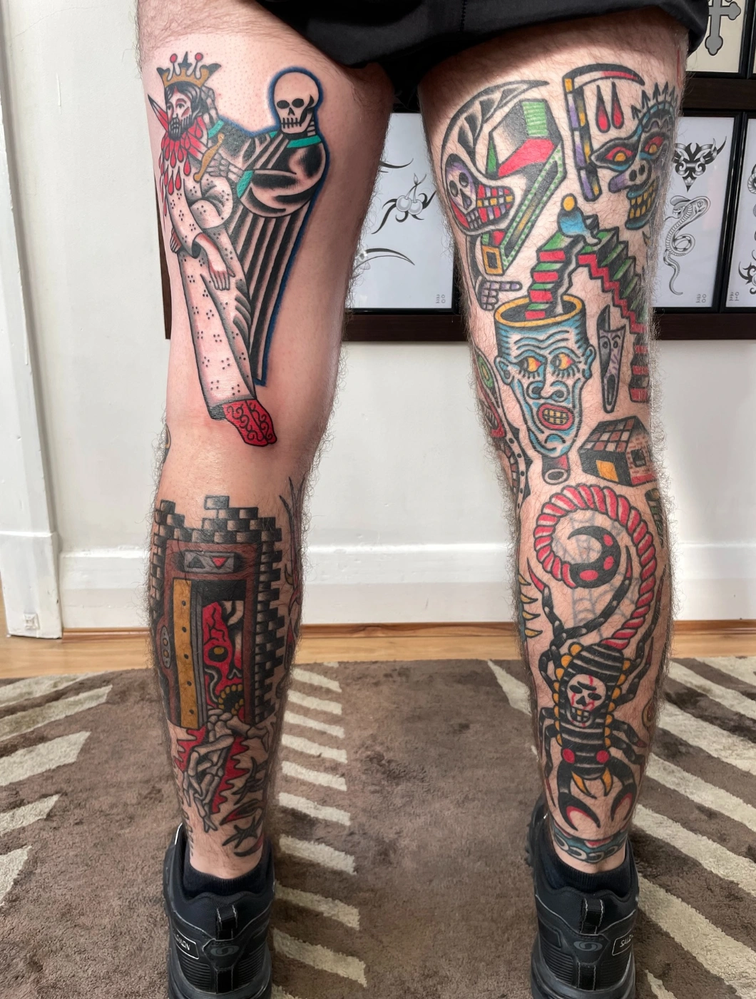 Colorful leg tattoo featuring a skeleton and snake design.