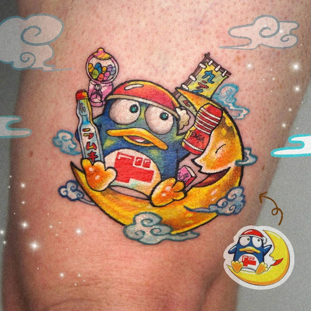 Colorful cartoon character tattoo on thigh.