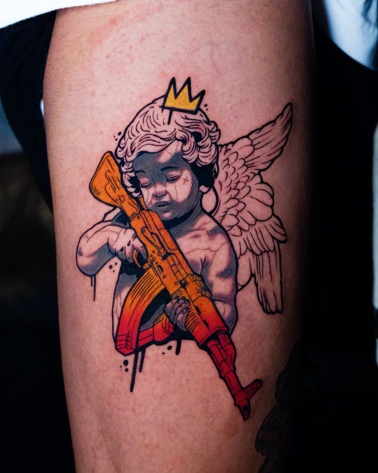 Bold Angel with a Gun Tattoo