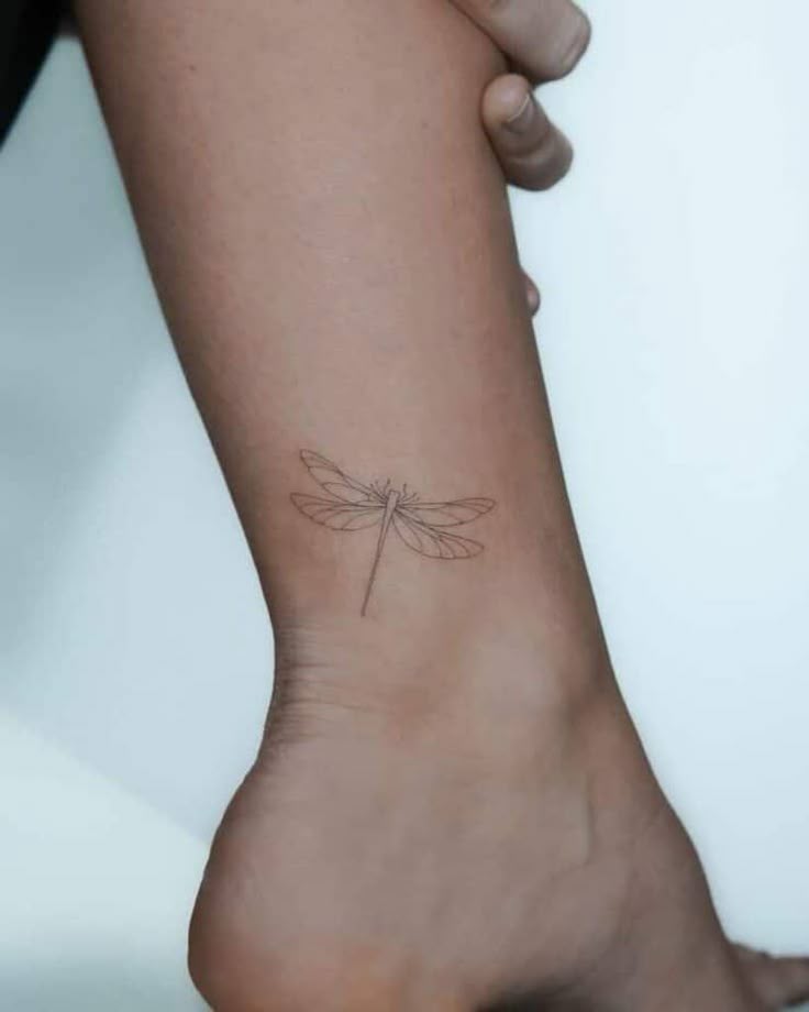 Elegant Minimalist Dragonfly Ankle Tattoo