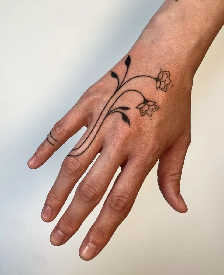 Delicate Floral Hand Tattoo
