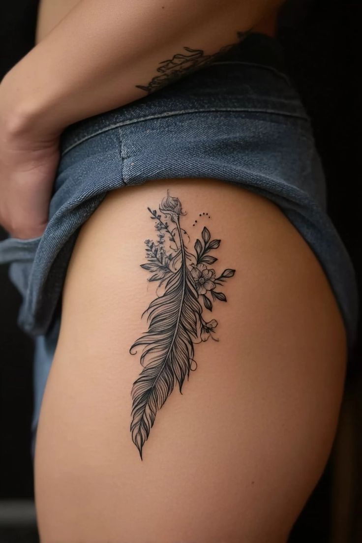 Elegant Feather Hip Tattoo Design
