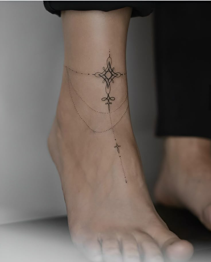 Elegant Blackwork Ankle Tattoo for Femininity