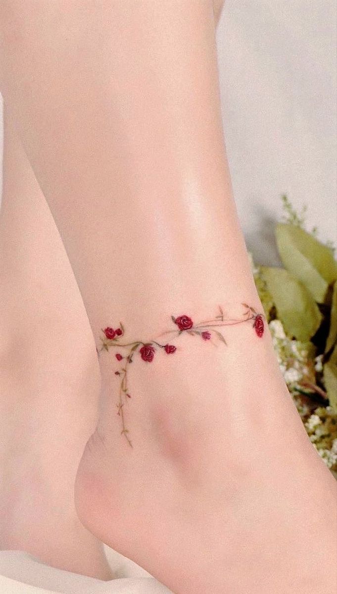 delicate floral ankle tattoo with roses
