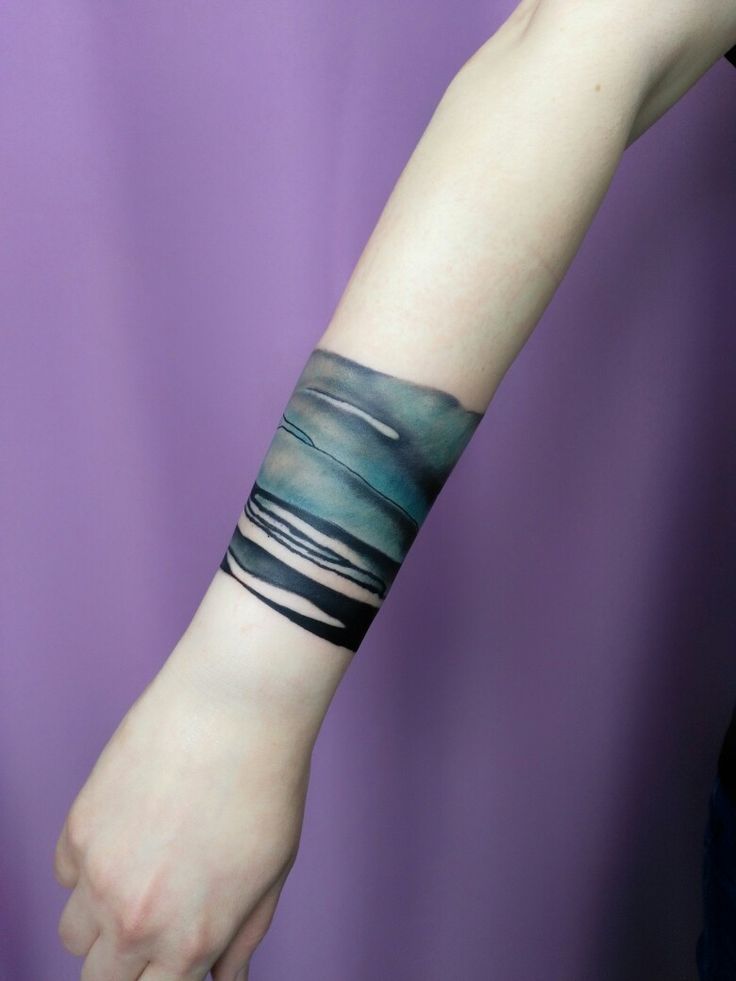 Artistic Watercolor Forearm Tattoo