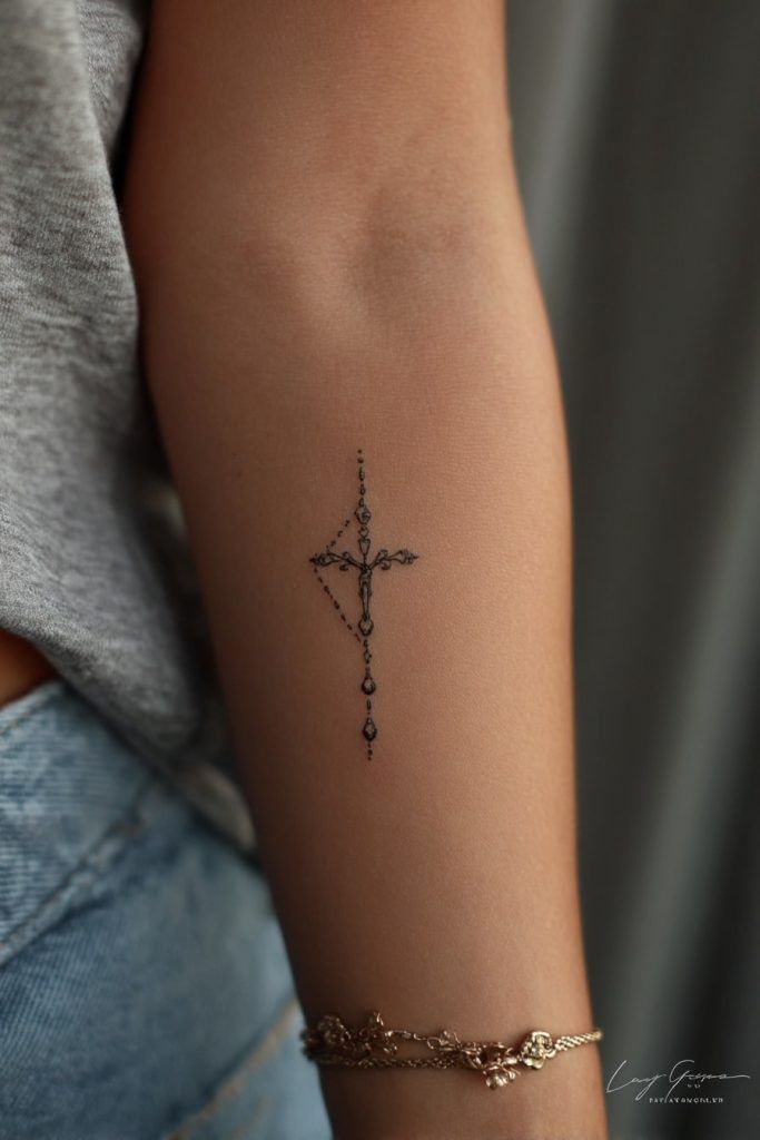 Elegant Minimalist Cross Tattoo