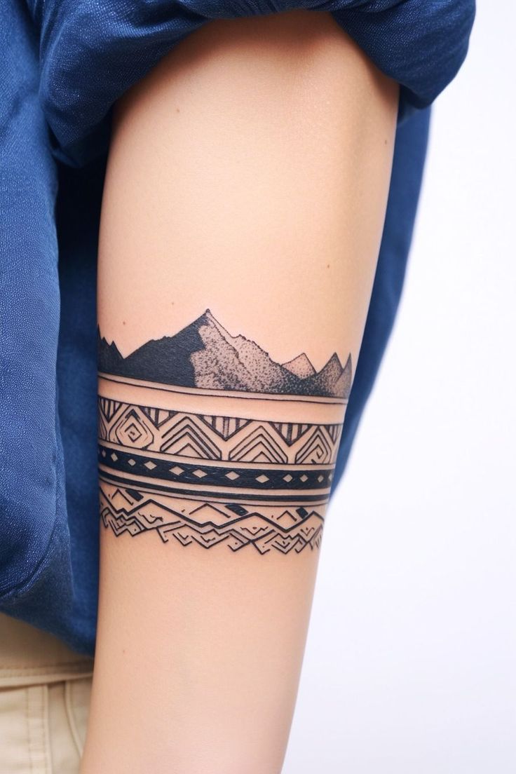 Bold Tribal Armband Tattoo with Mountain Motifs