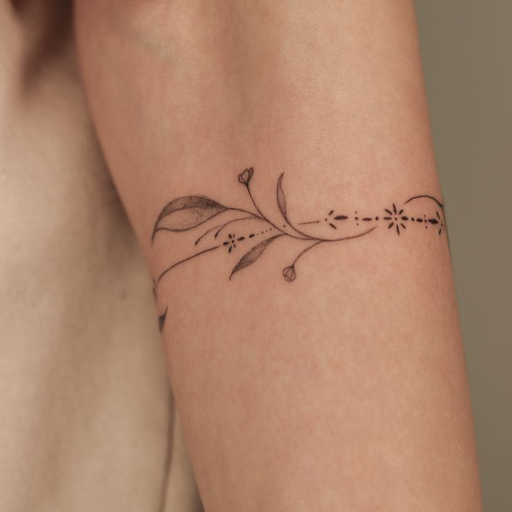 Delicate Floral Arm Tattoo