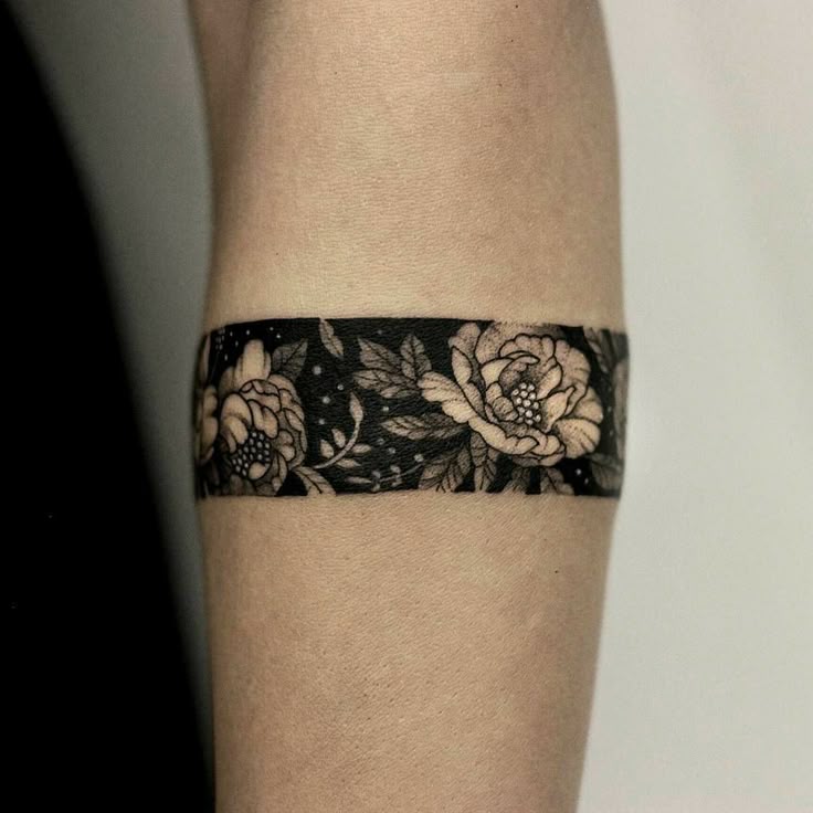 elegant floral armband tattoo