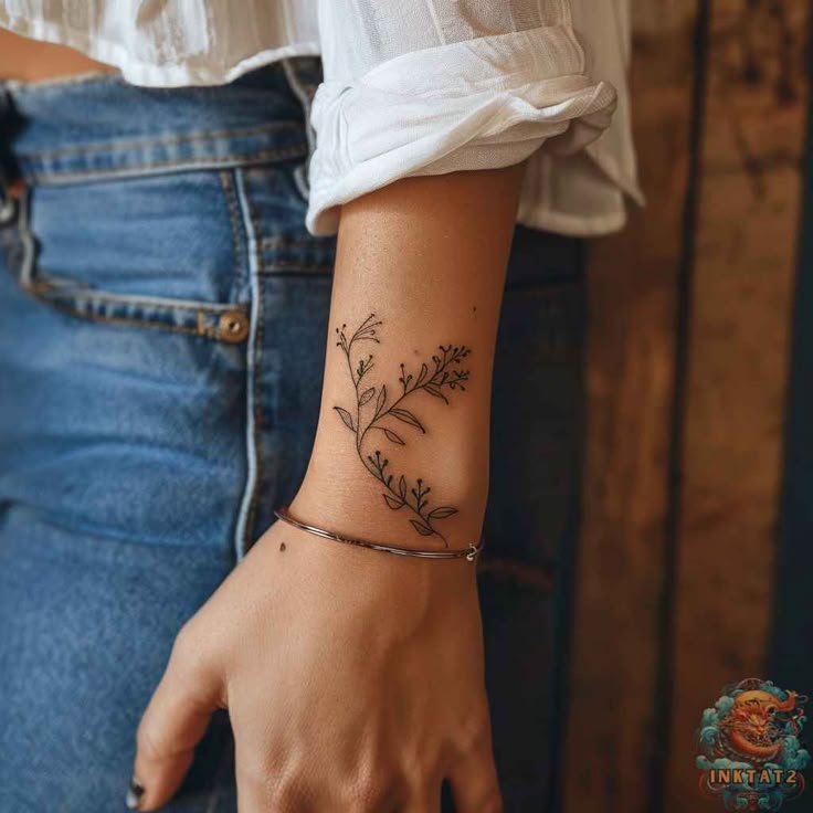 delicate floral forearm tattoo design