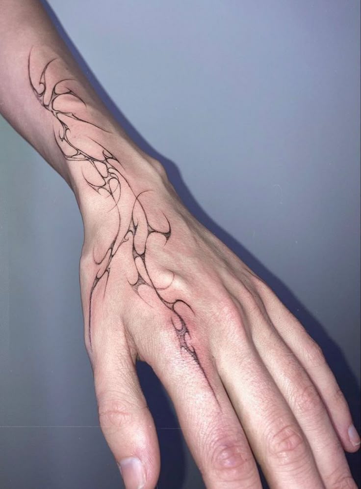 elegant minimalist hand tattoo design