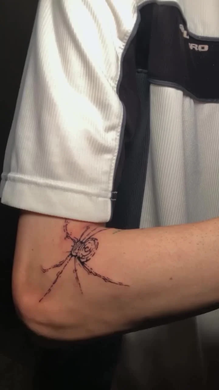Intricate Spider Tattoo on Arm
