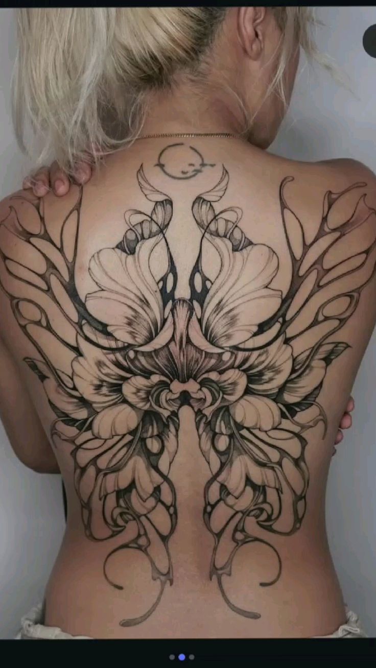 Intricate Floral Back Tattoo Design