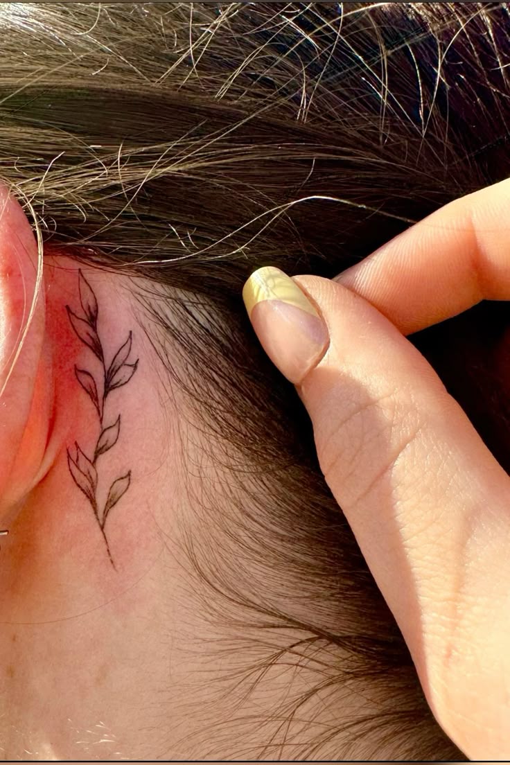 elegant behind-the-ear floral tattoo 🌿