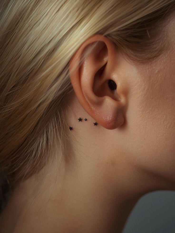 Charming Minimalist Star Tattoo Behind the Ear