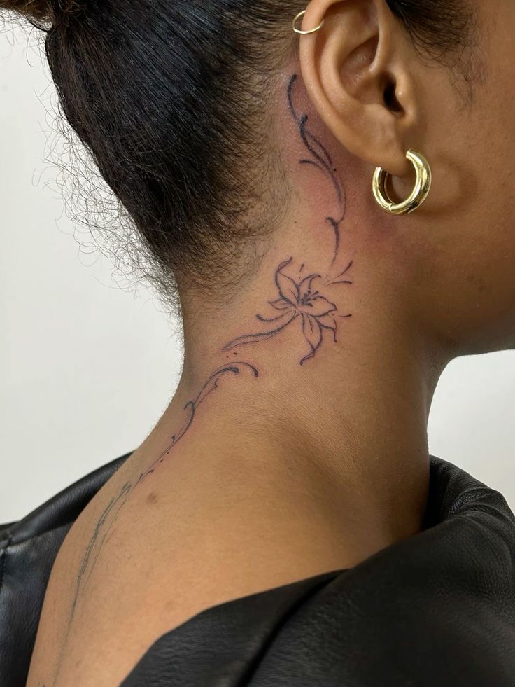 Delicate Floral Tattoo Behind the Ear