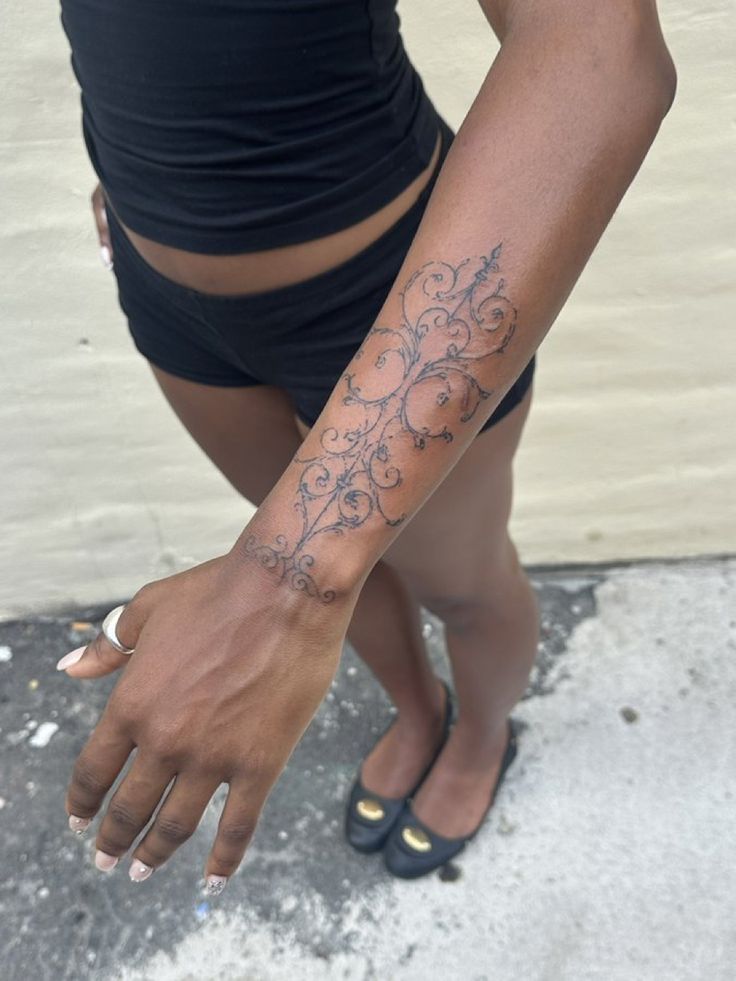 Elegant Floral Blackwork Arm Tattoo