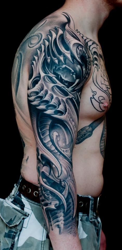 Intricate Biomechanical Dragon Arm Tattoo