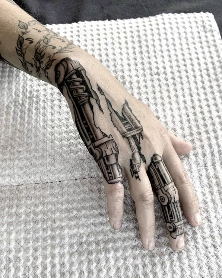 futuristic biomechanical hand tattoo