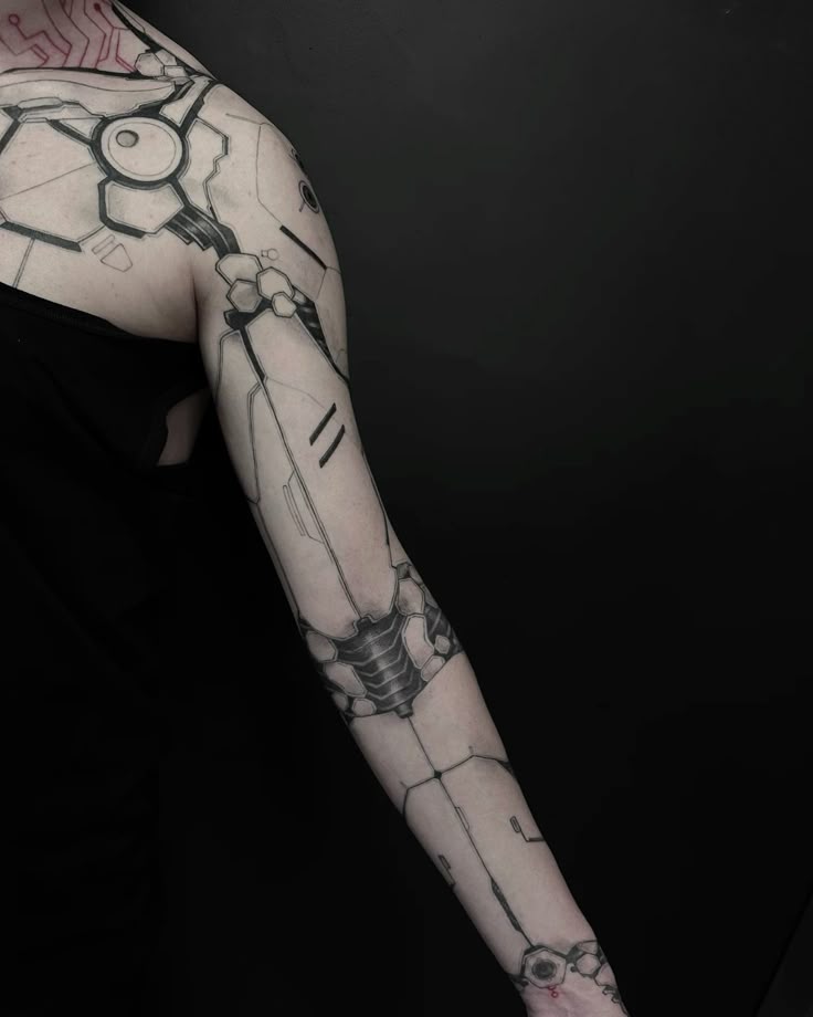 futuristic biomechanical arm tattoo