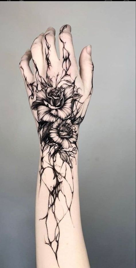 Intricate Floral Hand Tattoo Design