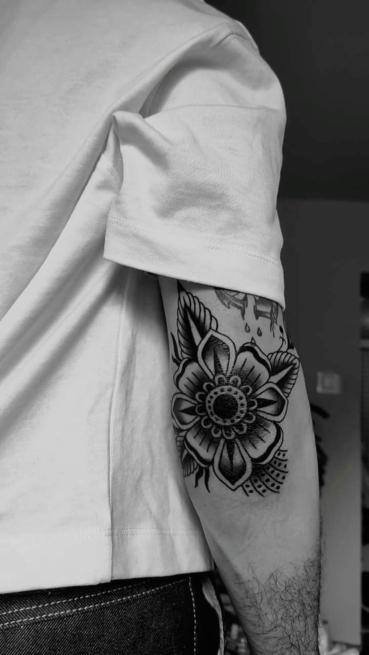 Elegant Floral Elbow Tattoo in Black and Gray