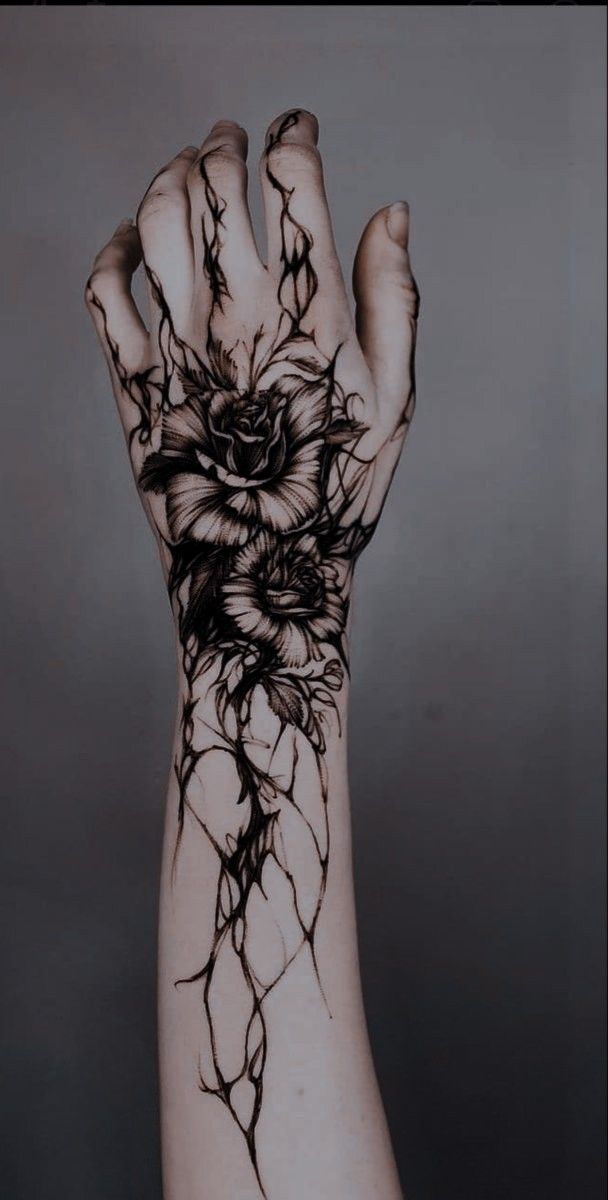Intricate Blackwork Floral Hand Tattoo