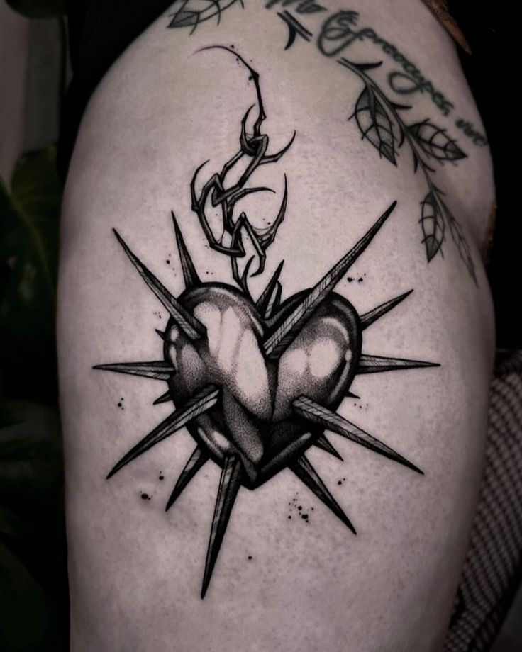 edgy heart with spikes tattoo