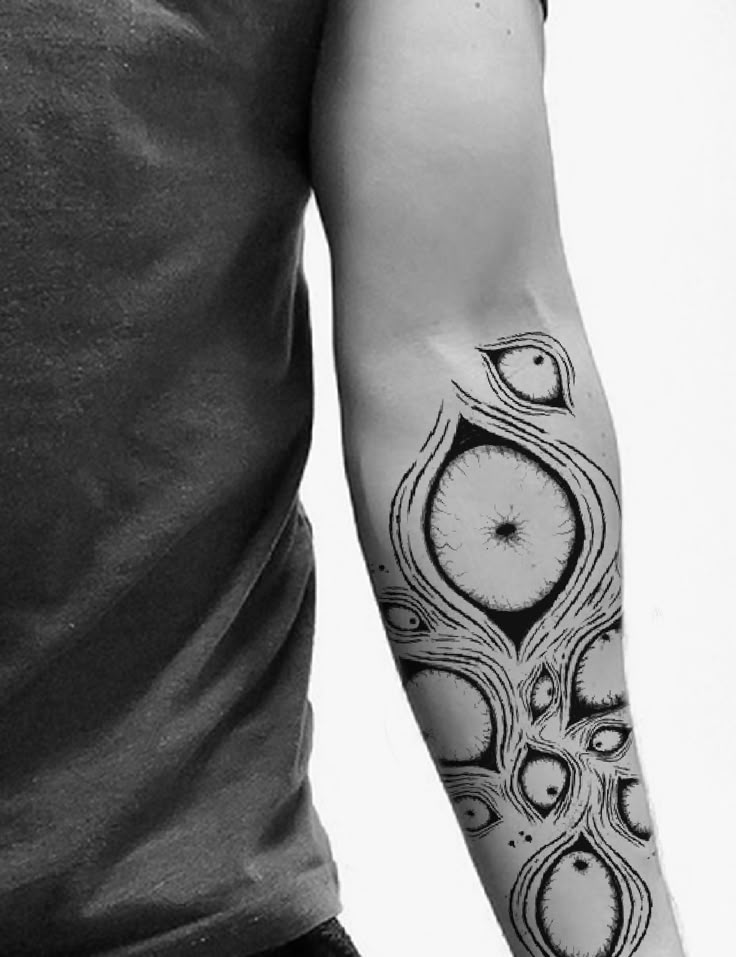 Creepy Eyes Blackwork Arm Tattoo