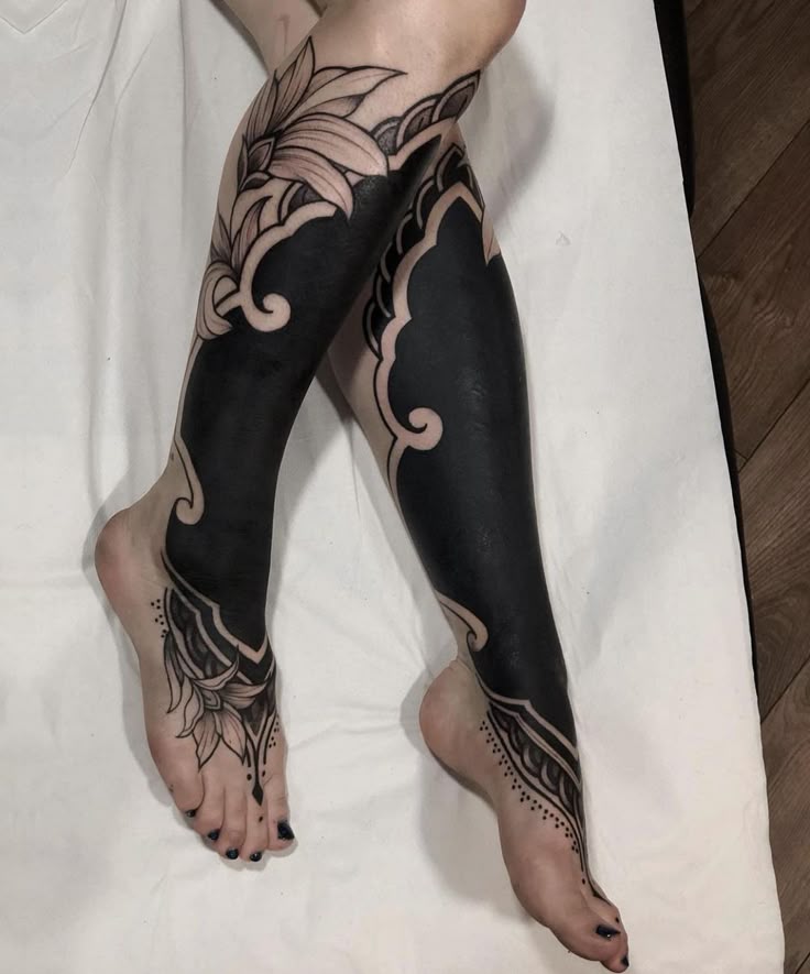 Elegant Blackwork Leg Tattoo Design