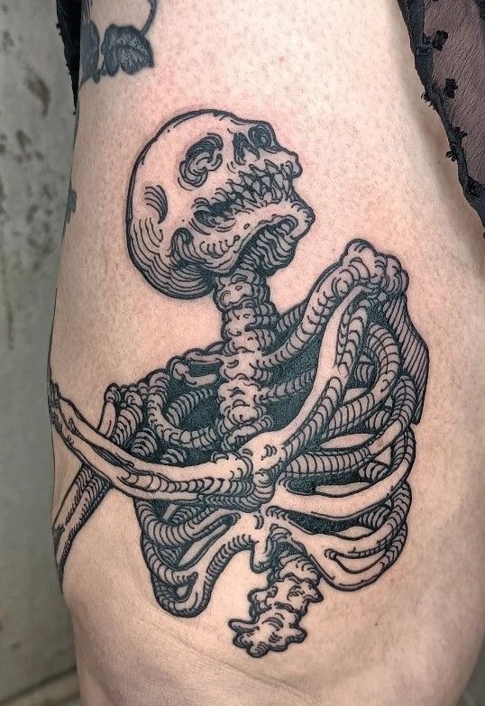 Playful Skeleton Calf Tattoo