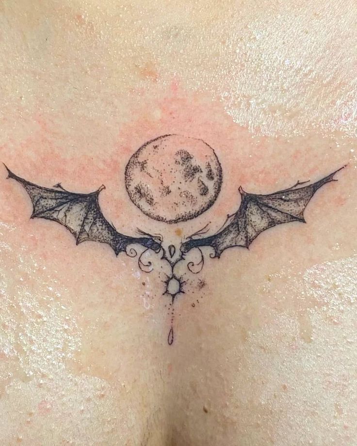 gothic bat and moon chest tattoo design
