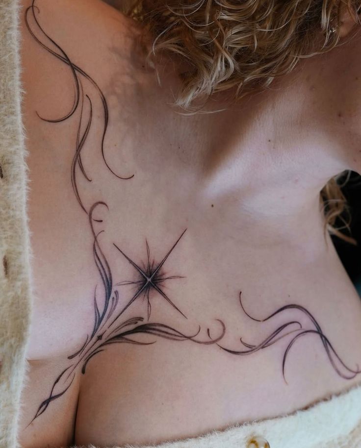 elegant blackwork chest tattoo design