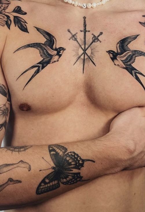 Elegant Blackwork Chest Tattoo with Birds and Swords