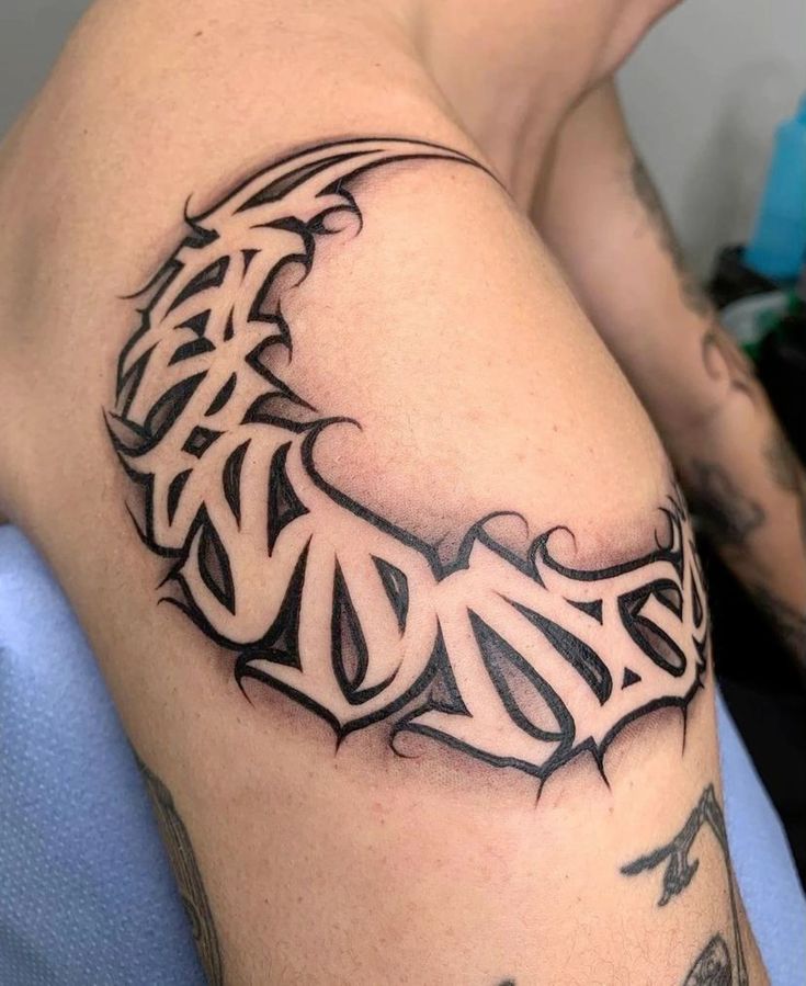 Gothic Crescent Lettering Tattoo