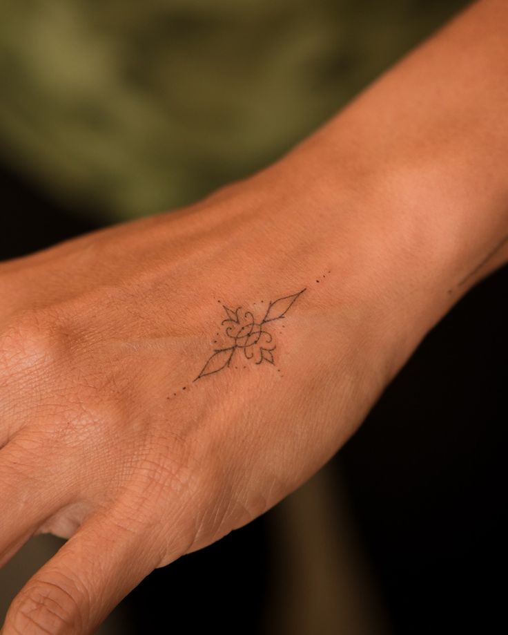 Elegant Dotwork Hand Tattoo
