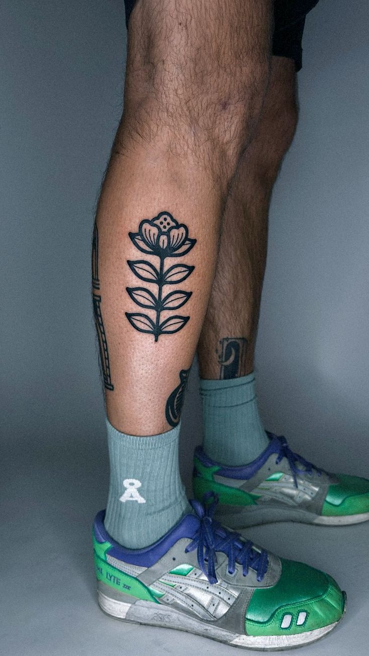 Bold Blackwork Flower Tattoo for the Leg