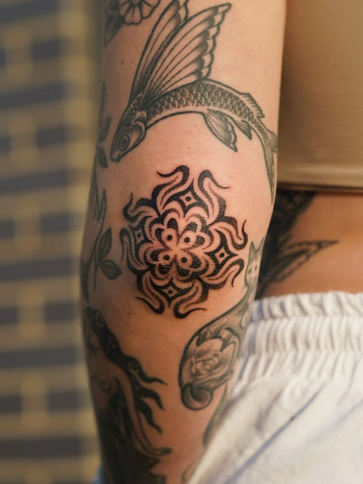 Elegant Dotwork Elbow Tattoo Design