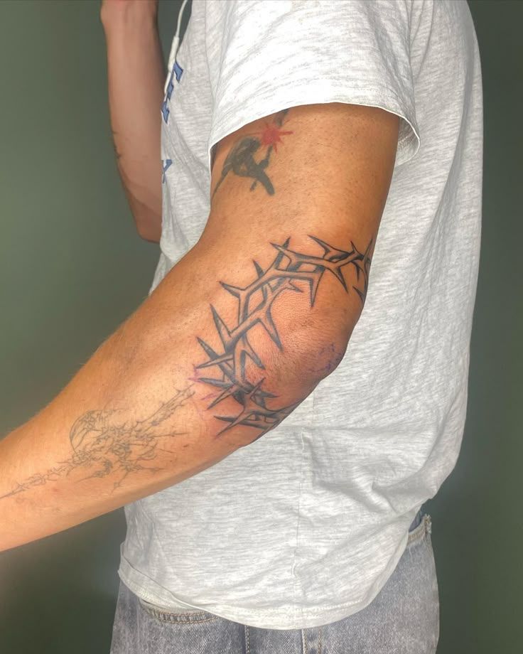 Edgy Elbow Thorn Tattoo Design
