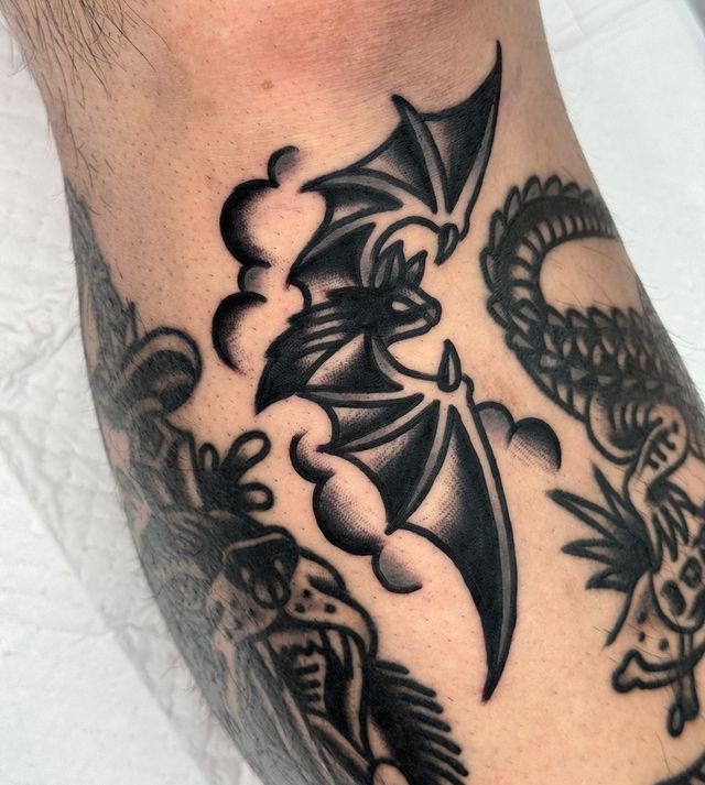 Bold Bat Elbow Tattoo in Traditional Style
