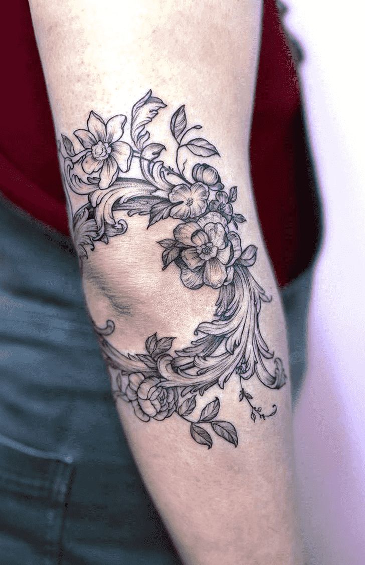 Elegant Floral Elbow Tattoo Design