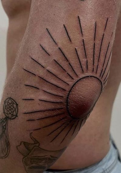 Radiant Sun Elbow Tattoo