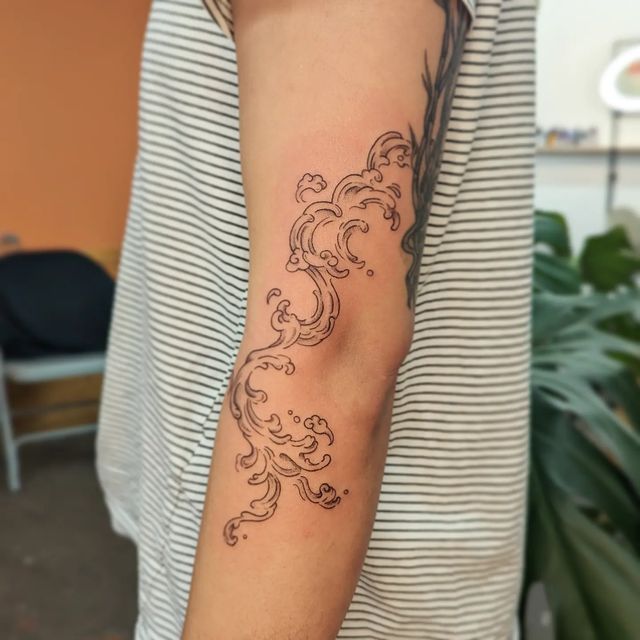 Freehand Cloud Elbow Tattoo