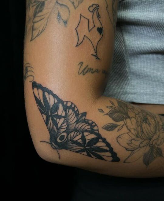 Elegant Moth Tattoo on Elbow: A Symbol of Transformation