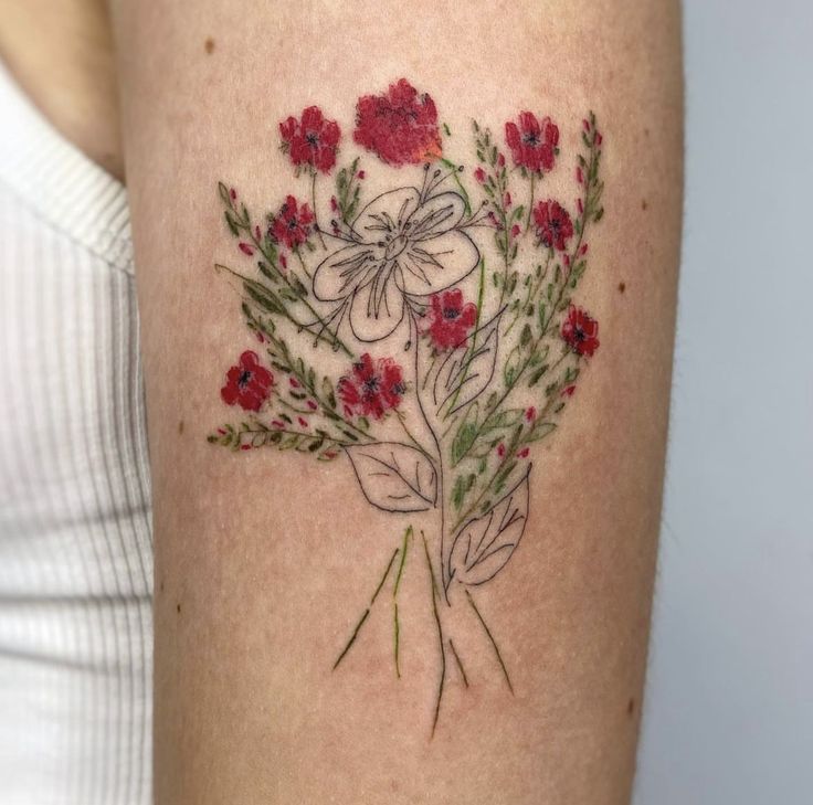 vibrant floral embroidery tattoo