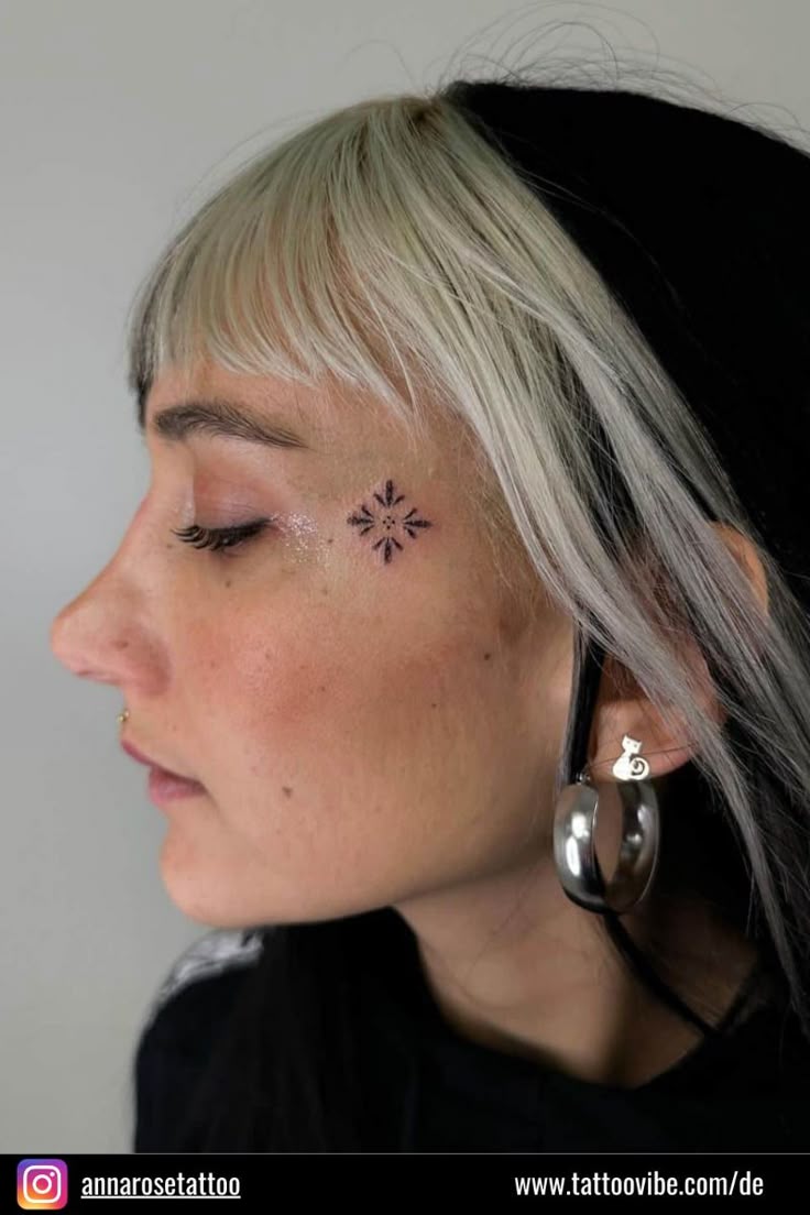 Delicate Minimalist Face Tattoo