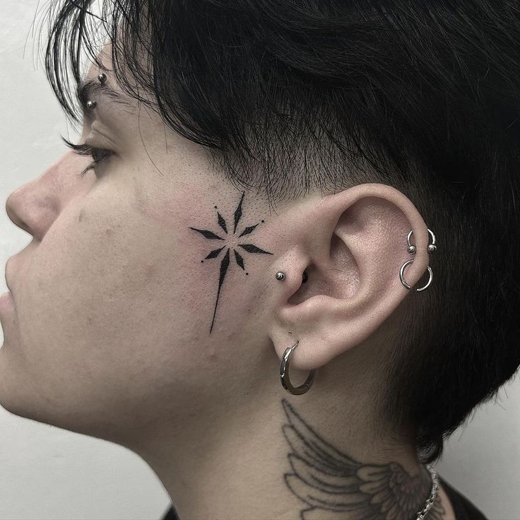 Minimalist Star Face Tattoo