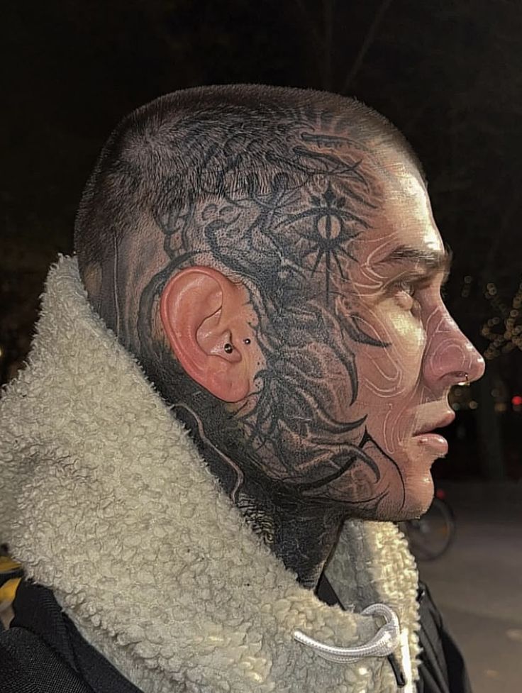 Bold Blackwork Face Tattoo Design