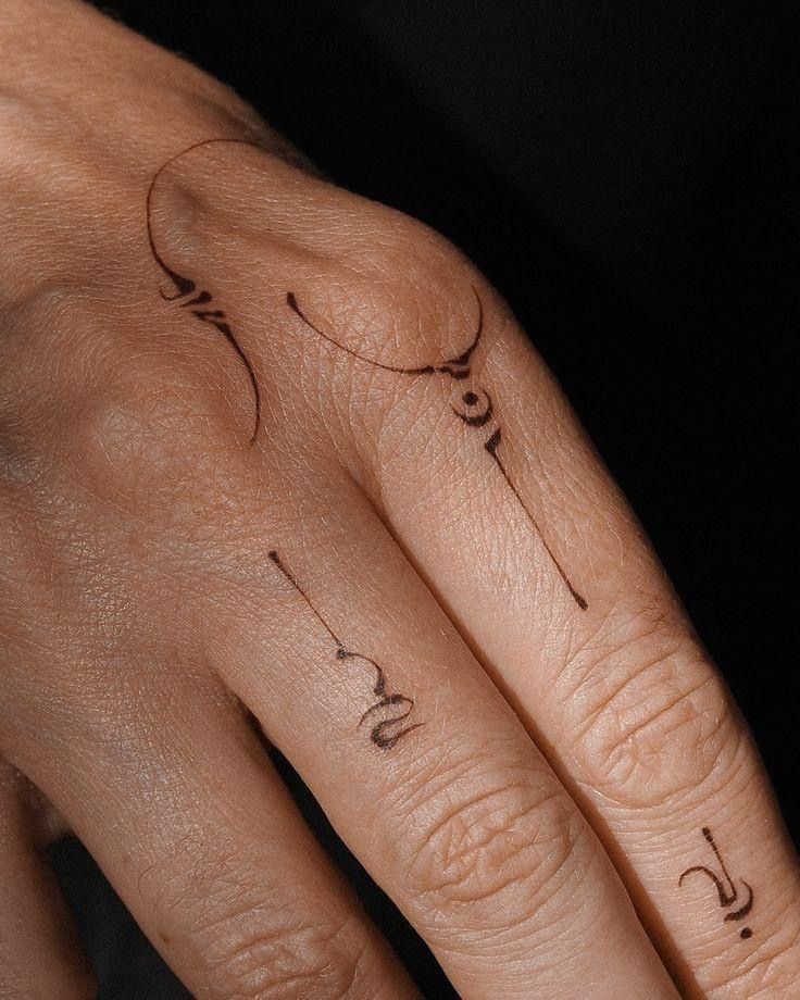 Elegant Fine Line Hand Tattoo