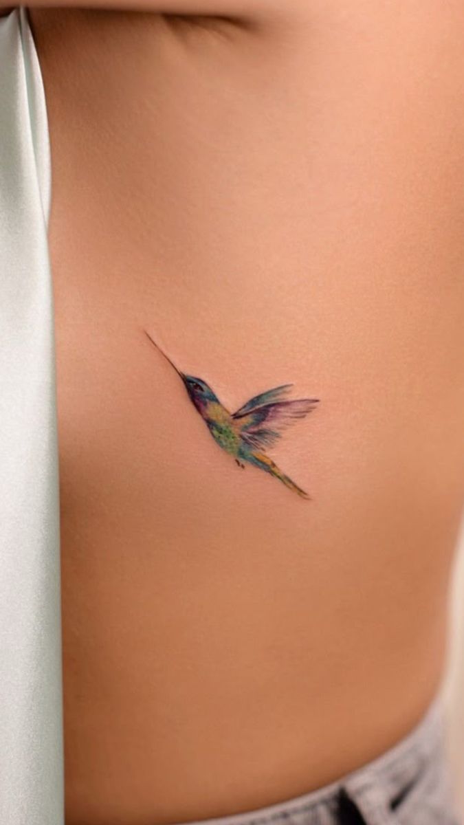 Delicate Hummingbird Ribcage Tattoo